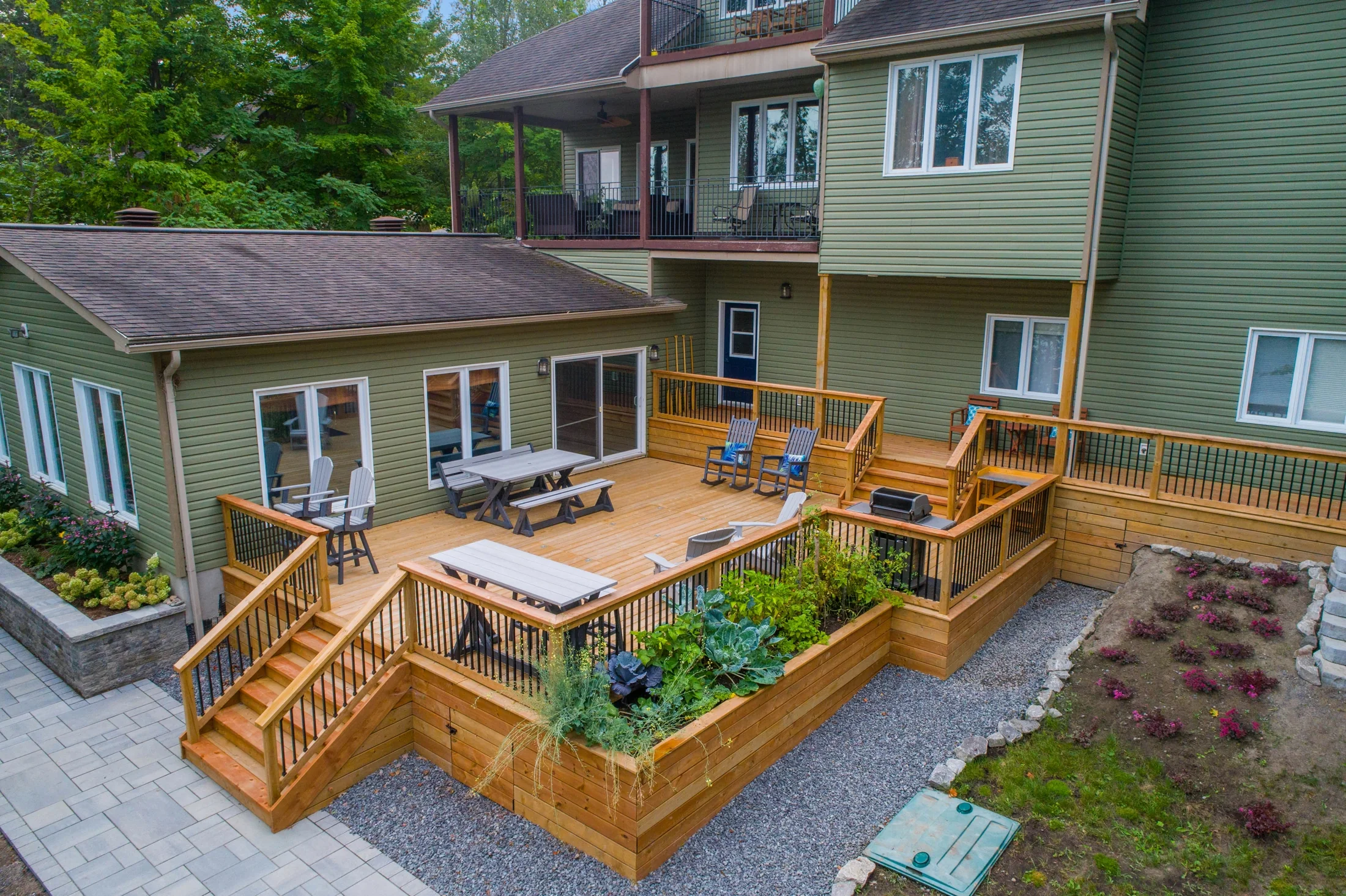 Backyard deck footprint with stairs, railings, and outdoor living layout